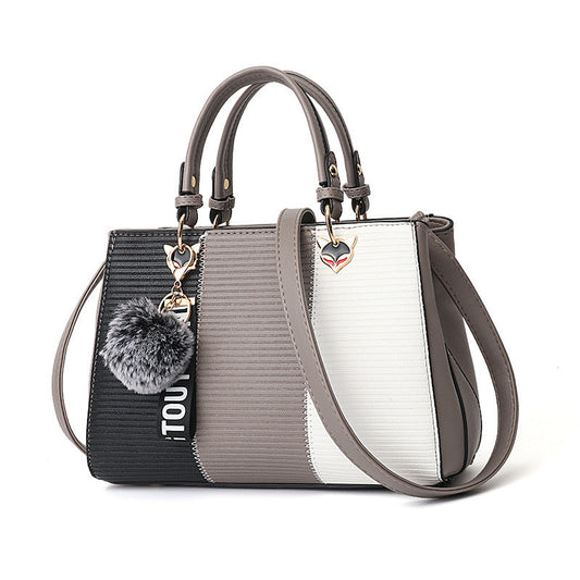 Damen-Patchwork-Handtasche mit Fellbommel